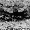 Excavation photograph : stone feature 103 and pebbe/shell "flooring", trample surface.