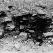 Excavation photograph : detail of 102 - plus pebble/shell surface.