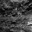 Excavation photograph : quarry dumping - ploughsoil line below ranging rod.
