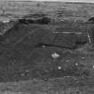 Excavation photograph : f009 - slot revealed in NW part of trench, from north.