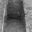 Excavation photograph : area 5 - ditch section in f4041, plan view, from east.