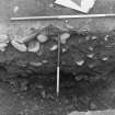 Excavation photograph : area 5 - revetment f4014, from west.