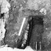 Excavation trench revealing grave