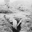 Excavation photograph. Furnace flue looking west.
Copied from A O Curle photograph album MS/28/461.
Duplicate of ST/1926.