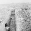 Excavation photograph. Section across shallow ditch, 131 ft S of Antonine 
rampart, looking E.
Copied from A O Curle photograph album MS/28/461.
