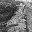 Excavation photograph. Probably rear wall of Principia