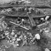 Excavation photographs: Hut circle 10/1.  Carbonised remains; interior face of hut circle in NW quadrant; general view of hut circle from above, showing excavations in progress.
