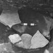 Excavation photographs: Black house at Doune Braes Hotel, Lewis; unidentified linear stone feature; unidentified post hole with stone packing; unidentified stone feature.
