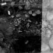 Excavation photograph : SW quadrant, cut 021 containing 025 and find 31.