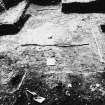 Excavation photographs: Site under excavation, including sections and close ups of finds in-situ.