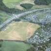 Aerial view of North Kessock oval enclosure and ring ditch cropmarks, Black Isle, looking ENE.