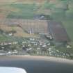 Aerial view of Portmahomack village and excavation, Tarbet Ness, Easter Ross, looking SE.