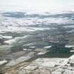 Aerial view of Cononbridge, Maryburgh and Dingwall under light snow, Easter Ross, looking N.
