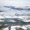 Aerial view of Loch Ussie and surroundings under snow, near Strathpeffer, Easter Ross, looking N.