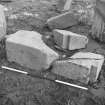 Excavation photograph : wrought stones, including rebated jambs.