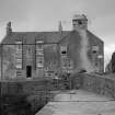 View of Harbour House, Cellardyke, with part view of 52-54 George Street, from north east.