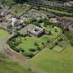 Oblique aerial view showing Holyrood Palace and Abbey, Edinburgh, plus part of Abbeyhill.