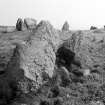 View from N showing stones of facade and chamber behind.