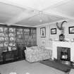 Interior view of Arbuthnott House showing library with fireplace.