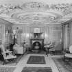 Interior view of Arbuthnott House showing east drawing room with fireplace.