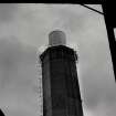 Image from photo album titled 'Braehead Oil Conversion', Chimney showing extension and scaffolding at top