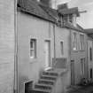 View of front elevation of 5 Water Wynd, Pittenweem, from north.