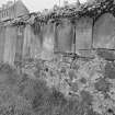 View of gravestones mounted on wall, Old Churchyard, Eyemouth.