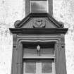 View of pediment above entrance doorway, south elevation, Ross Mains.