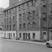 General view of 10-20 Charles Street, Edinburgh, with boy standing on wall.