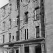 View of shop fronts including Gerard, on an unidentified street in the south of Edinburgh.