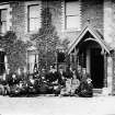 Photographic copy showing assembled persons outside Old Nobel House
