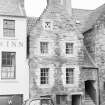 View of 46-48 High Street, Linlithgow, from S, with car parked outside.