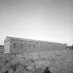 View from SE of surviving Quinan stove or drying house, latterly known as  R19 when converted to transit shed.