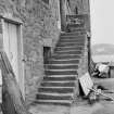 View of external stair, warehouse, Harbour Terrace, North Berwick, from NE.