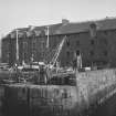 General view of warehouse and harbour, North Berwick, from SW.