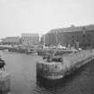 General view of warehouse and harbour, North Berwick, from SW.