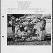 Photographs and research notes relating to graveyard monuments in Guthrie Churchyard, Angus. 
