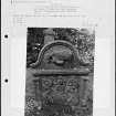 Photographs and research notes relating to graveyard monuments in Lundie Churchyard, Angus. 
