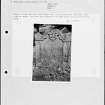 Photographs and research notes relating to graveyard monuments in Torryburn Churchyard, Fife.  
