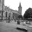 View from NE showing part of cemetery and N front of Palace and New Abbey Parish Church, Dunfermline Abbey, St Margaret's Street, Dunfermline. 