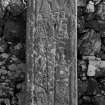Detail of West Highland medieval graveslab bearing sword, harpist, chalice and panel of interlace, St Comgan's Chapel, Glendale, Isle of Skye.