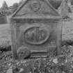 View of gravestone commemorating John Condie, 1720, with winged soul, pick and chisel, skull, double bones and hourglass, in the churchyard of Forgandenny Parish Church.