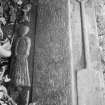 Detail of graveslab of John M. Lachee, 1758, showing sculpted figure, lettering and spade, in the churchyard of Buchlyvie Parish Church.