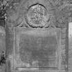 View of headstone commemorating Edward Cowan, 1767, in the churchyard of Bo'ness Parish Church, showing merchant, 4 in cartouche and inscription.