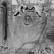 View of W face of headstone for T.D. and A.H., in the churchyard of Bo'ness Parish Church, showing anchor in centre of stone, with lettering either side.
