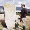 View of Craw Stane from SW; Dr Iain Fraser (RCAHMS) in picture