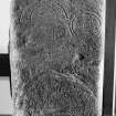 General view of Pictish stone bearing a serpent, Z-rod, horse-shoe with internal decoration, and a mirror-and-comb.