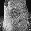 Flash-lit photograph of stone, now at Kinellar House, showing mirror-case, 'shield and spear' and double-crescent symbols.