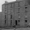 General view of 7, 9, 11 and 13 Brown Street, Edinburgh, with three children.