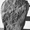 General view of Pictish stone bearing a crescent and V-rod above a triple-disc symbol.